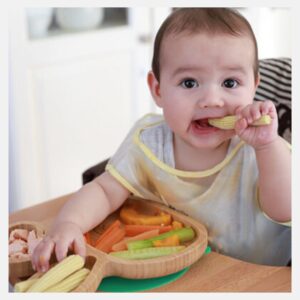 Example of a baby chewing a variety of healthy foods.